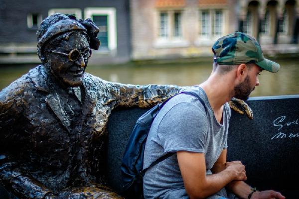 Streets of Amsterdam. Boy and bronze old man.